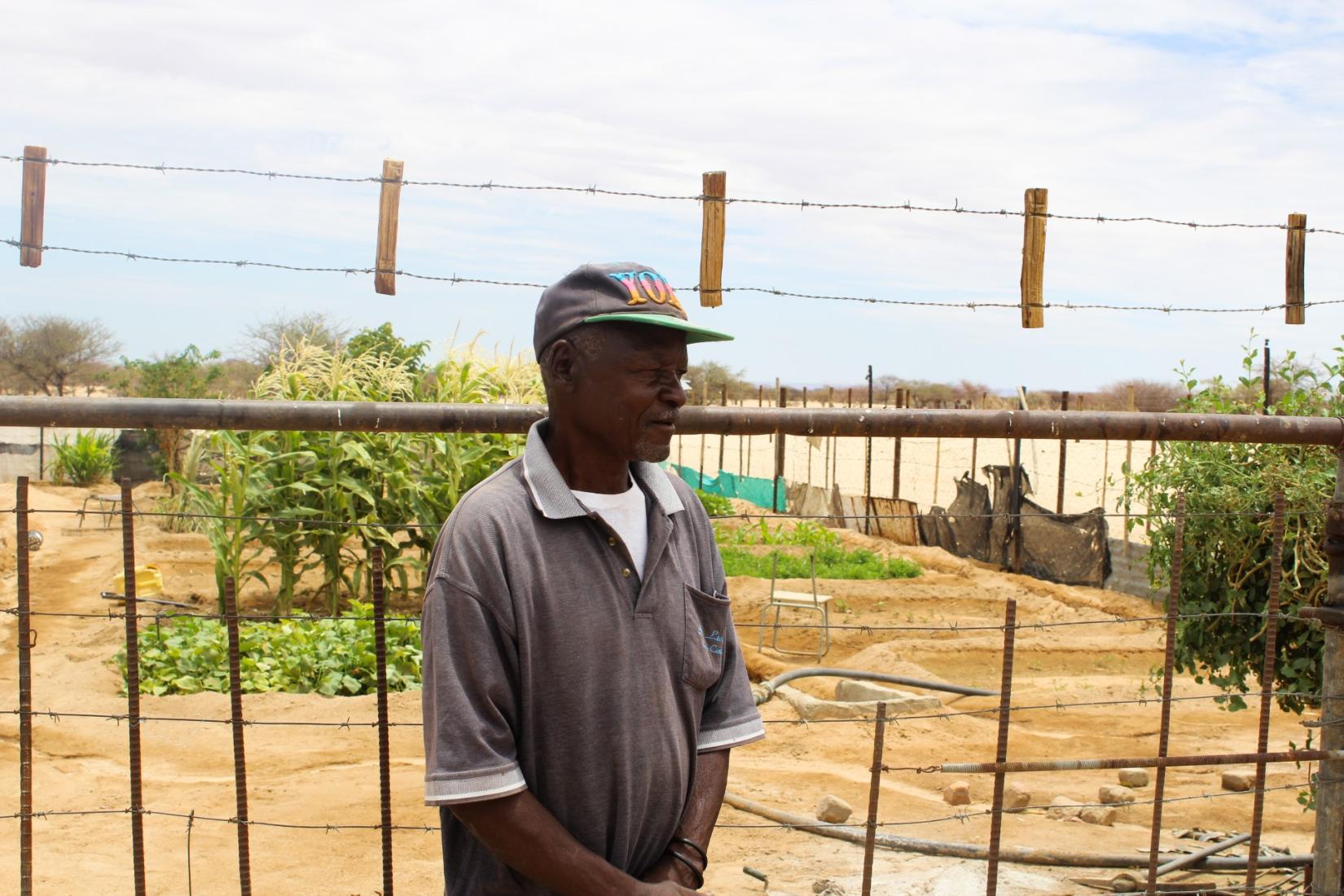 Mr. Rudolf Aibeb standing in front of his garden