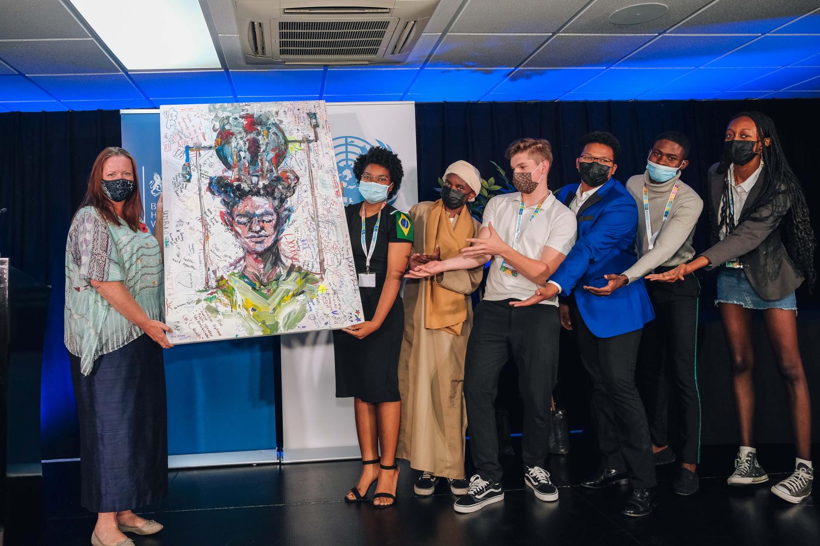 MUN Participants hand over painting to H.E Charlotte Felton