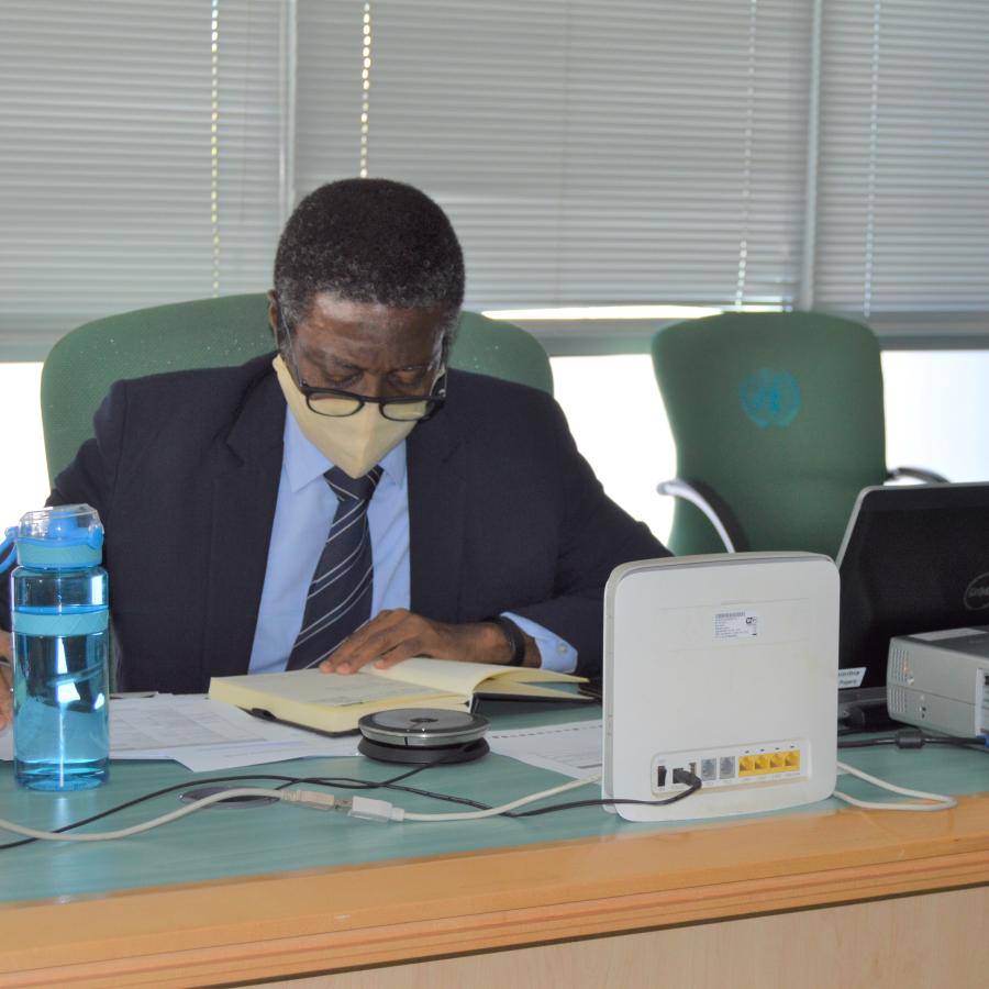 Dr. Charles Sagoe-Moses chairing the virtual meeting with partners