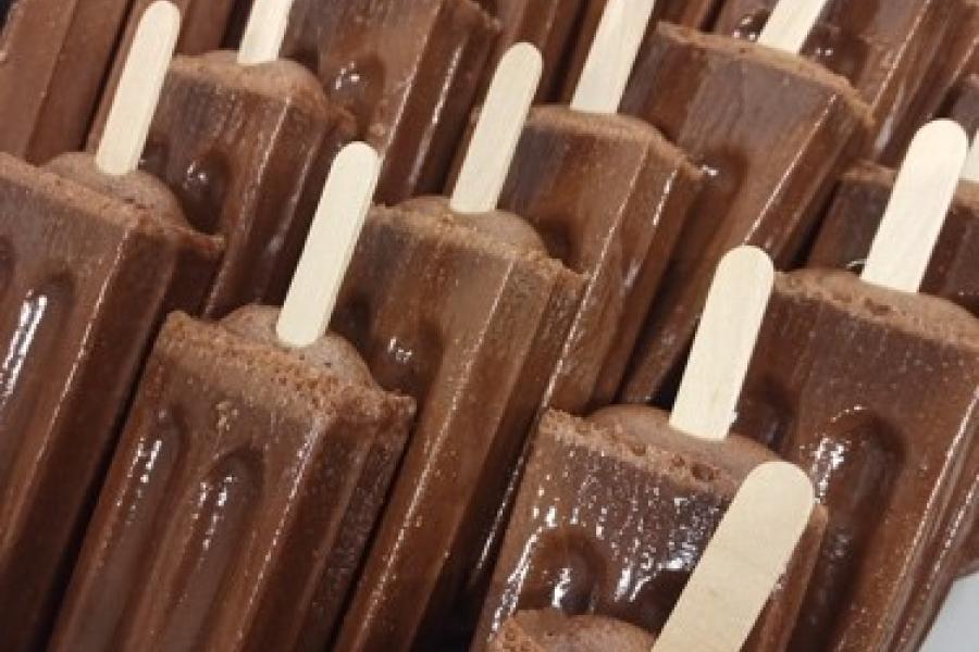 a tray of chocolate popsicles