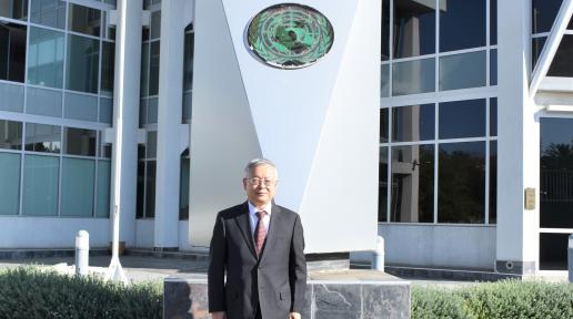 UN Resident Coordinator, Sen Pang pictured infront of the UN House in Namibia
